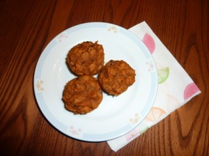 A plate with pumpkin muffins on it